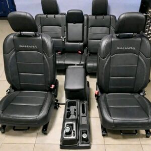 Black leather interior seats and center console for a Jeep Wrangler Sahara.